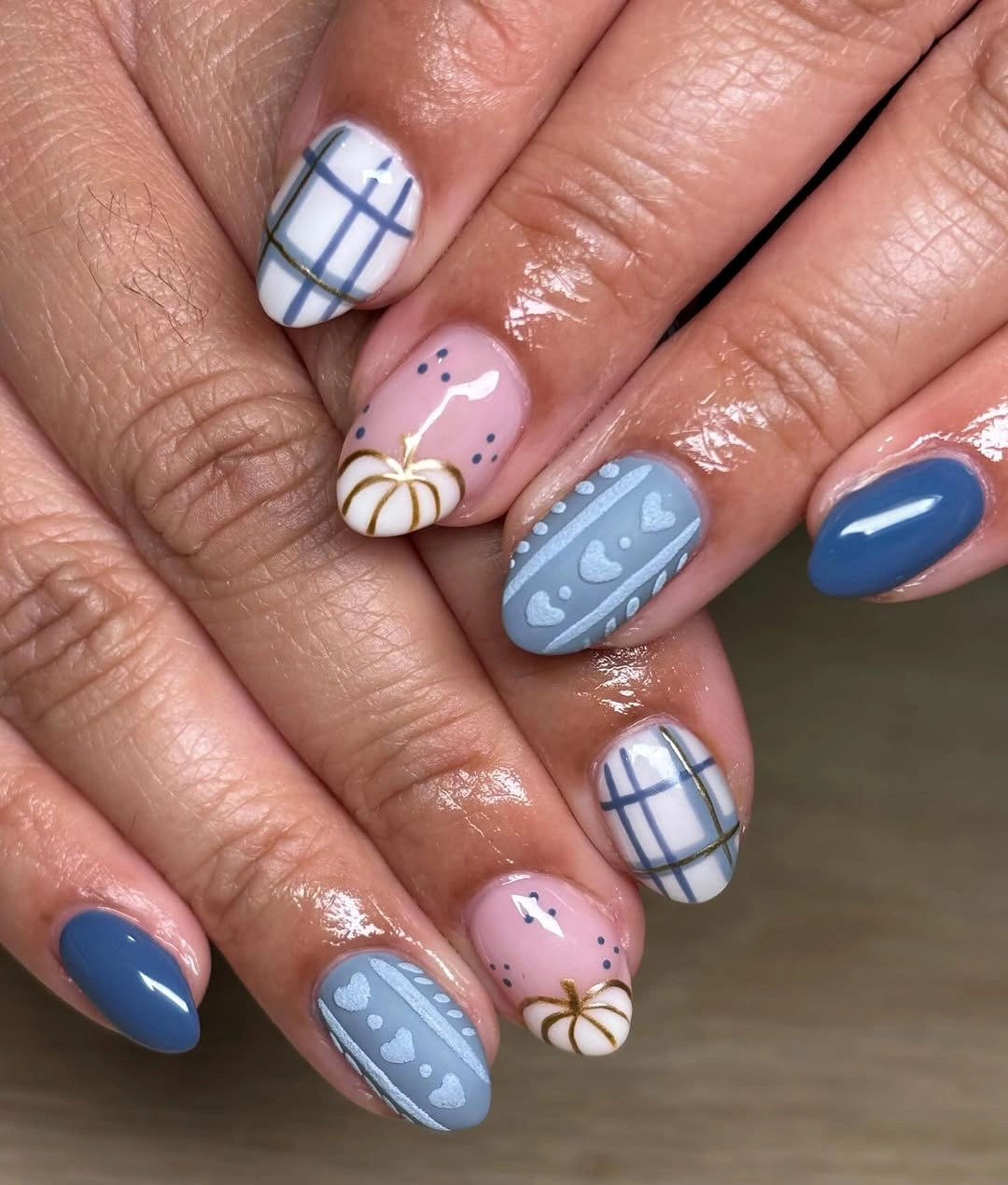 Medium almond blue pink nails with plaid and colorful pumpkin accents