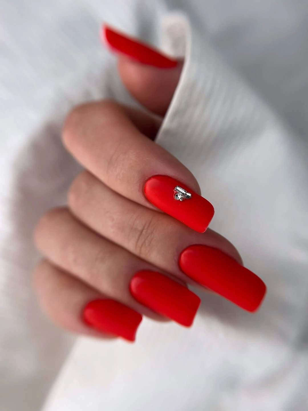 Matte red square nails with silver accent