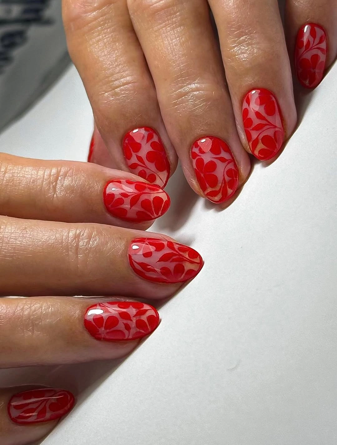 Short tonal red floral nails