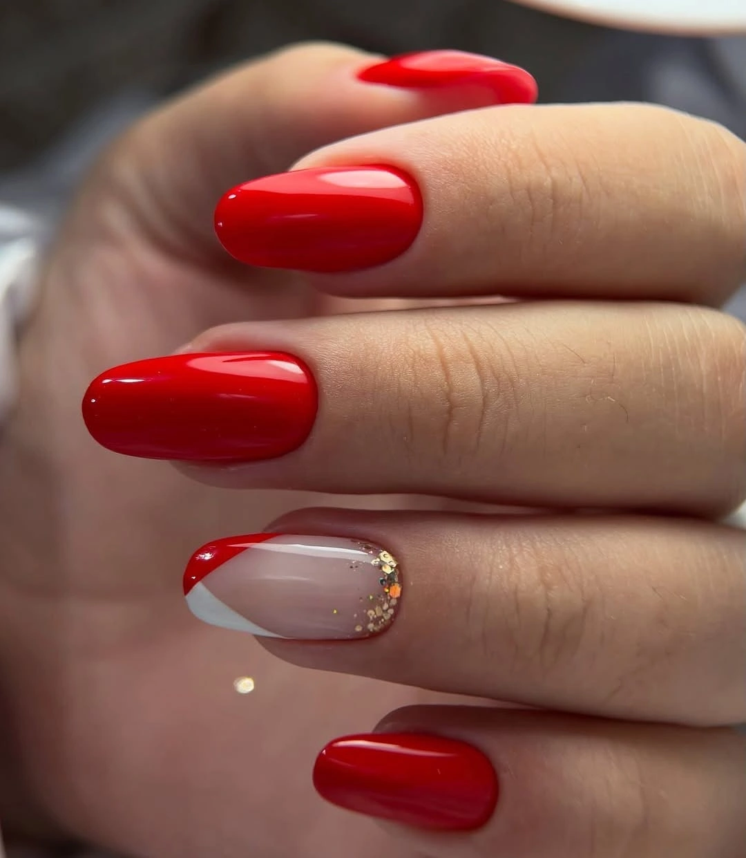 Red almond nails with white diagonal accent
