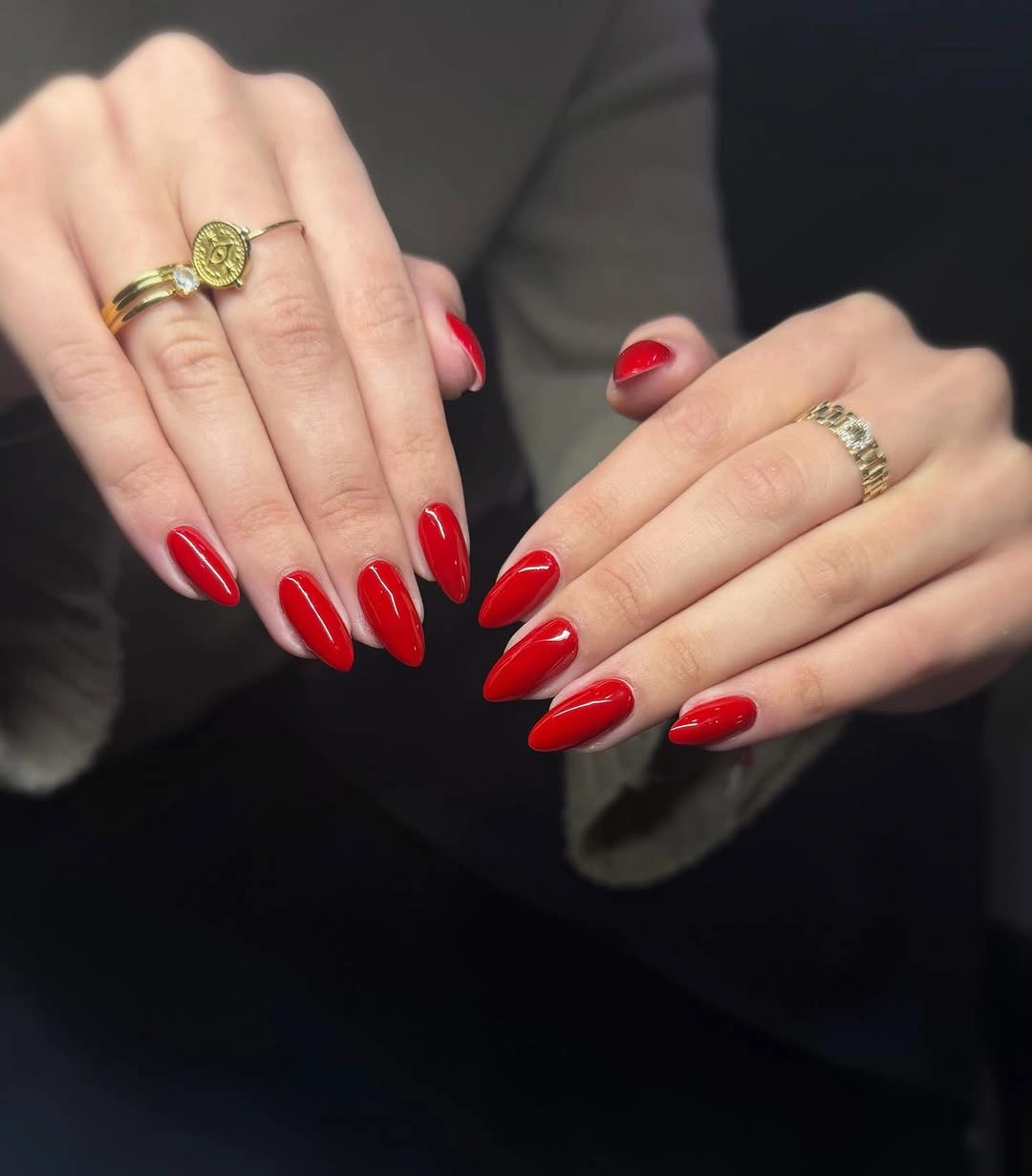 Solid bright red medium-long almond nails