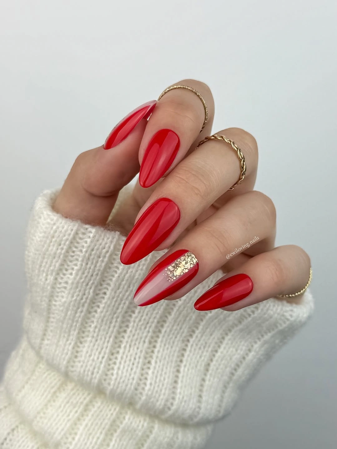 Red almond nails with gold accent