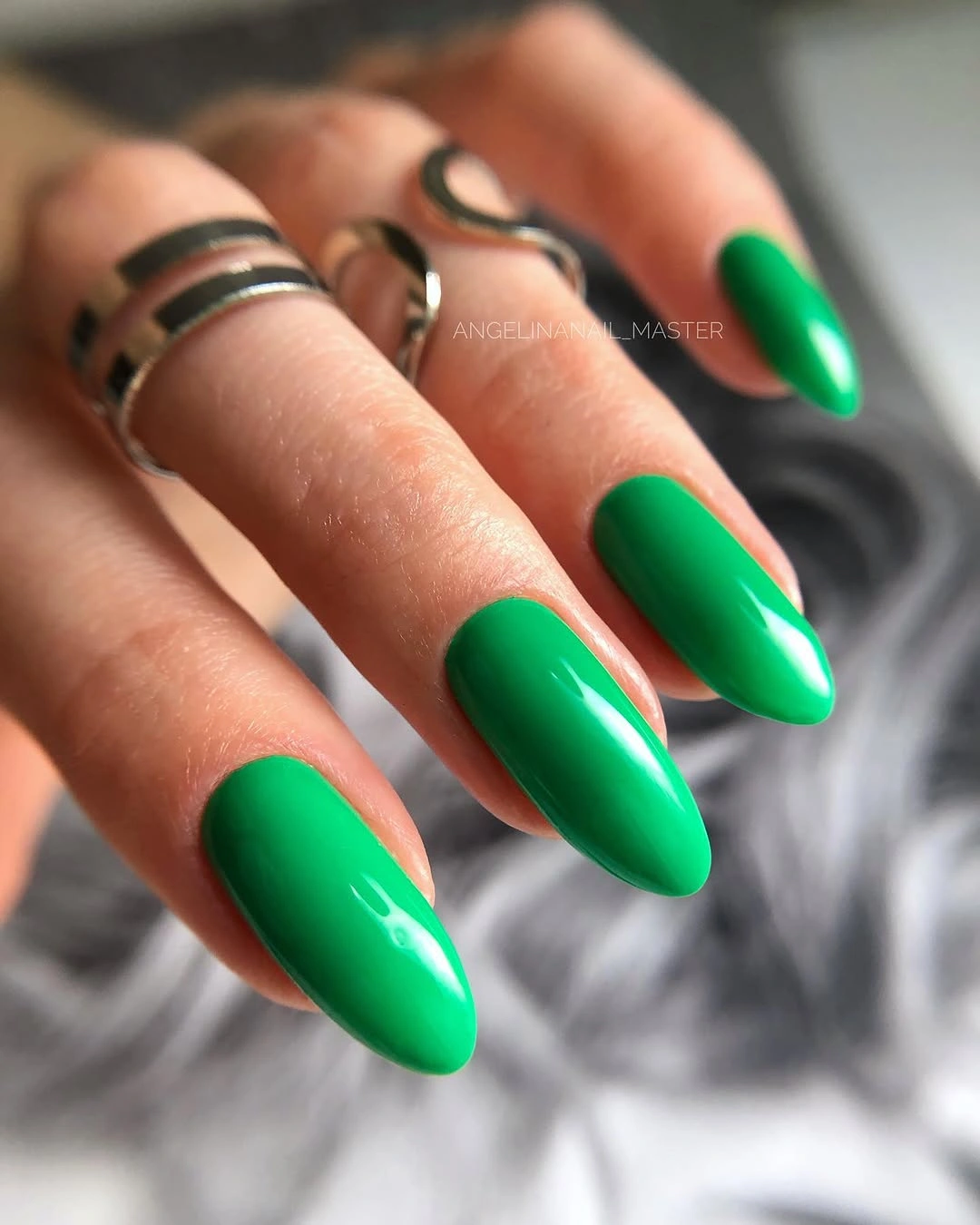 Medium almond nails in bright glossy green