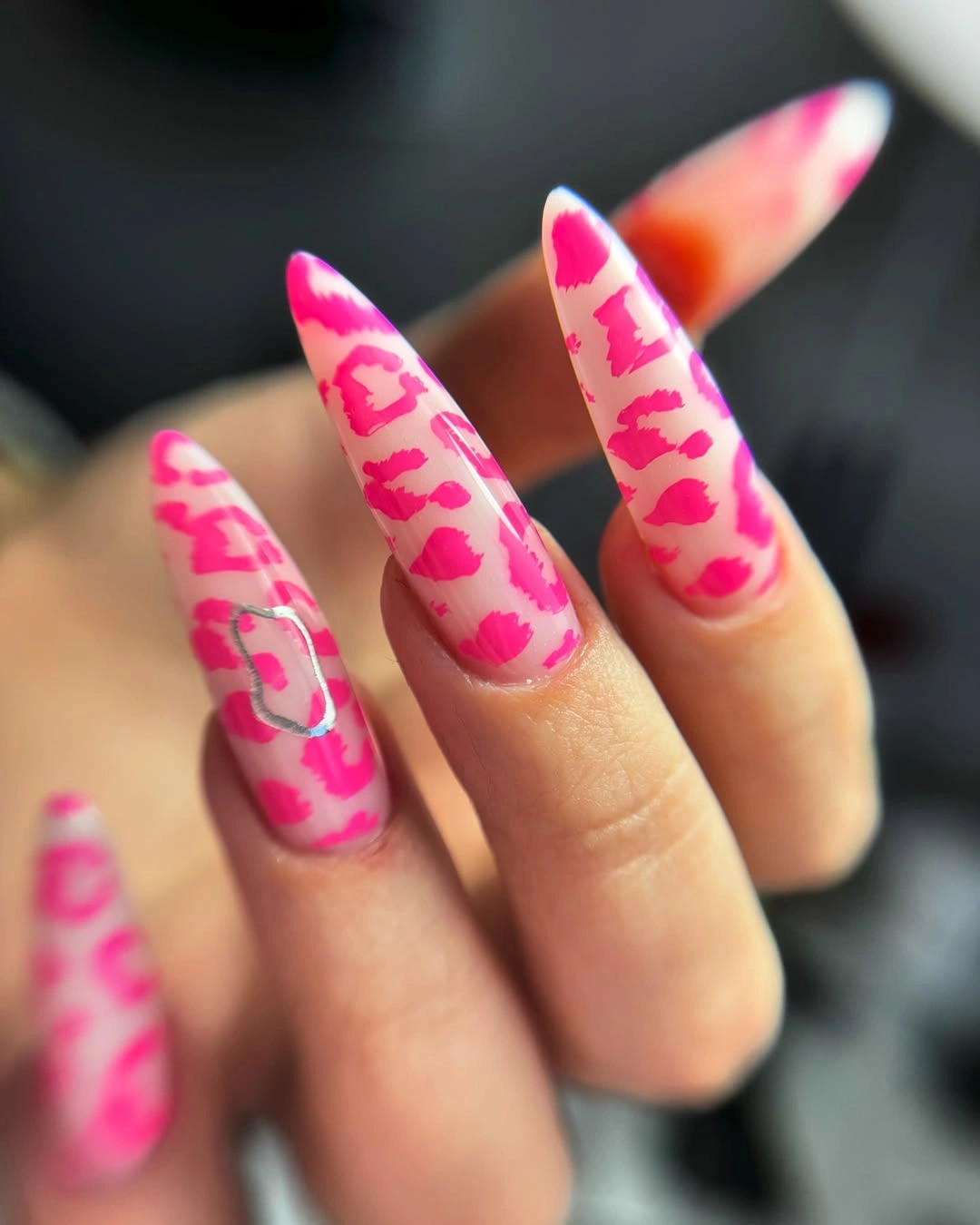 Long almond nails with hot pink and lighter pink abstract markings