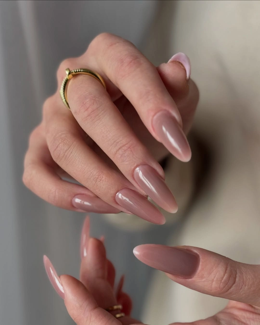 Long almond nails in sheer pink nude with soft gloss