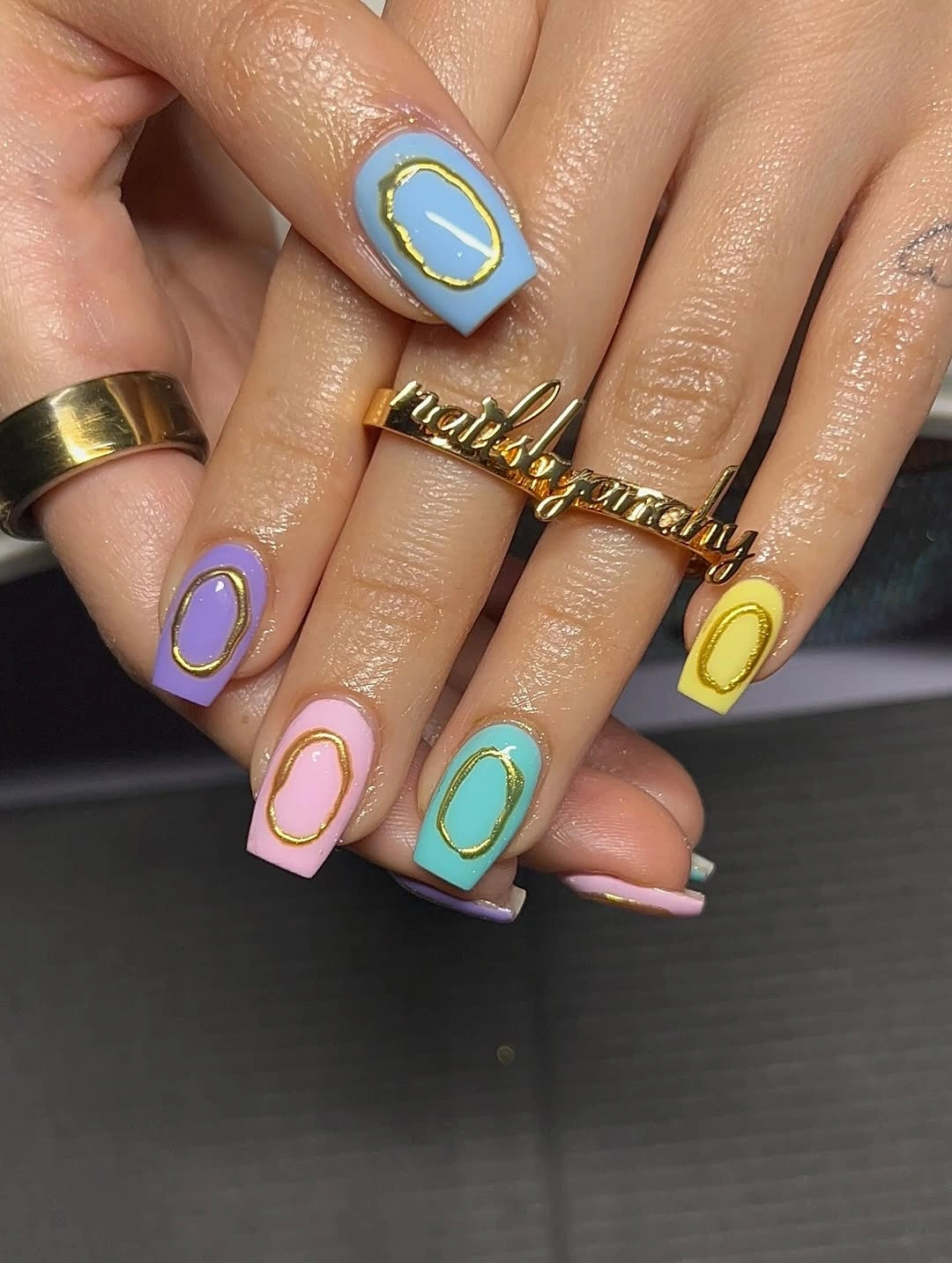 Pastel square nails in blue lavender pink and yellow