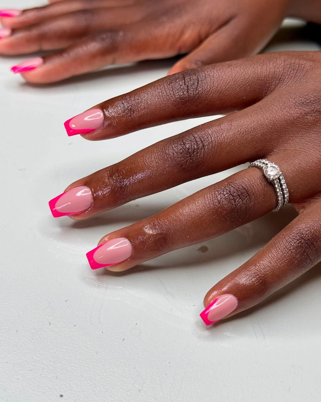 Translucent pink square nails with vivid fuchsia edges