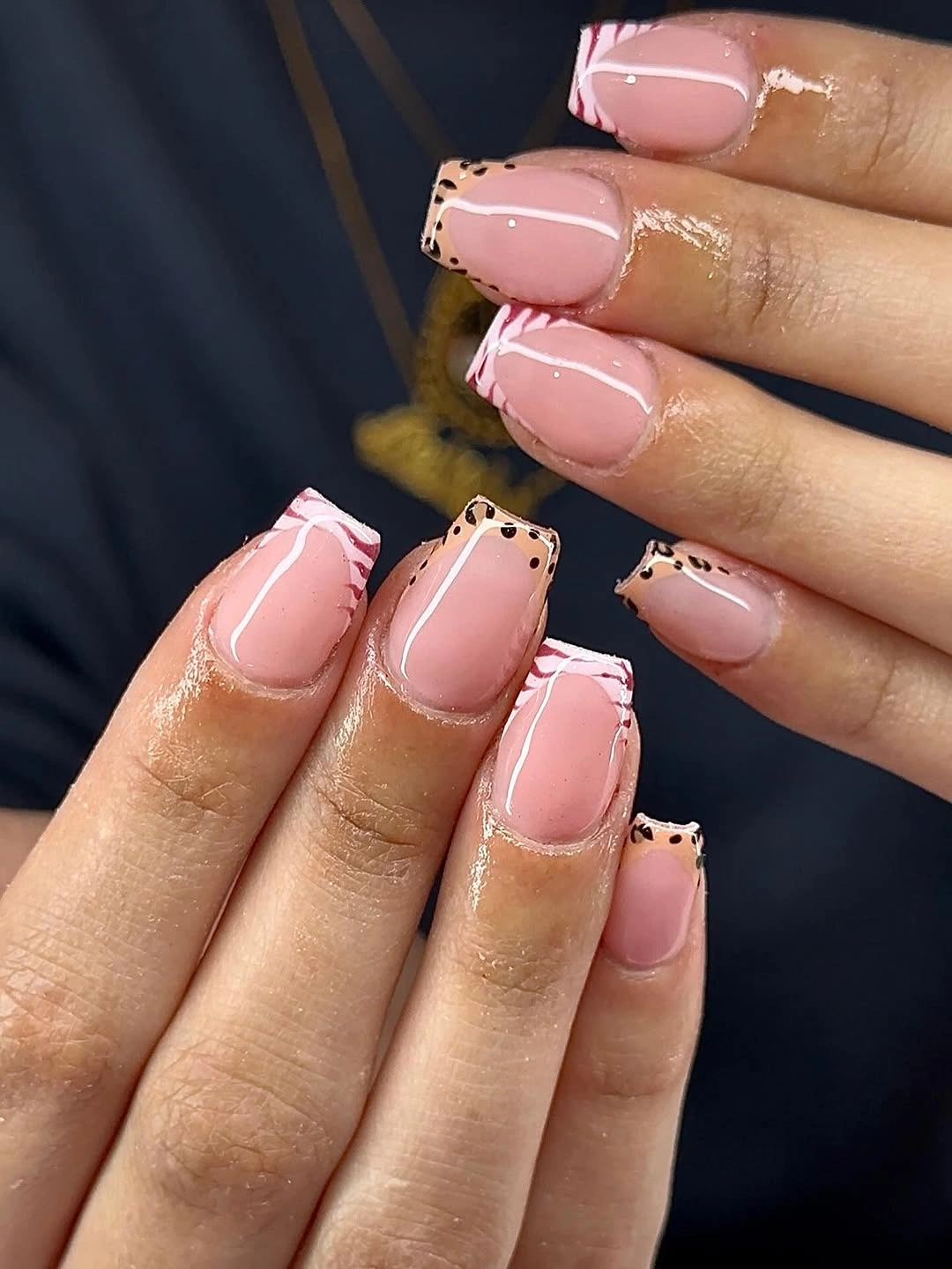 Pale pink square nails with dotted black border details
