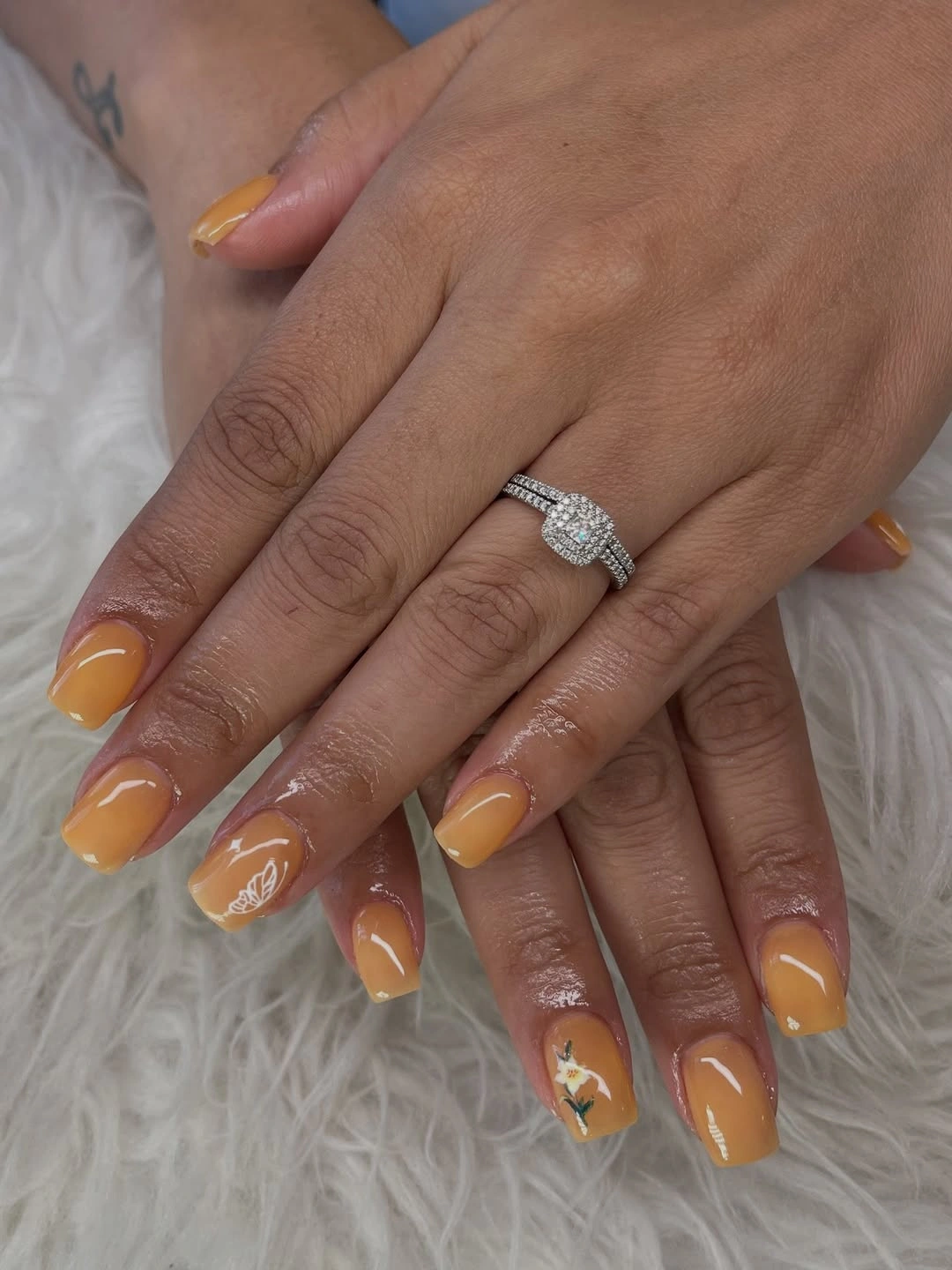 Mustard yellow short square nails with small white accents