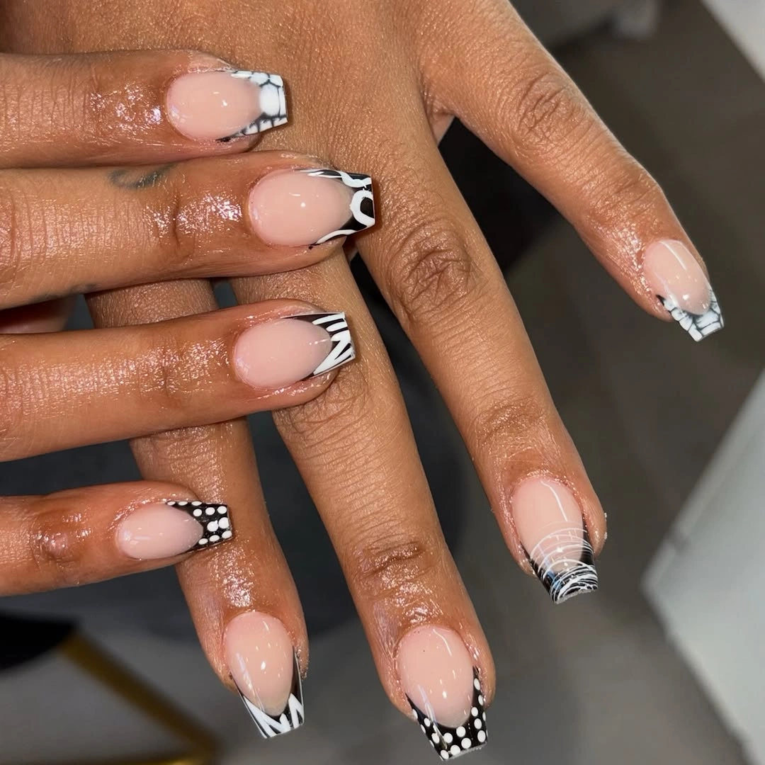 Nude square nails with black and white graphic French tips