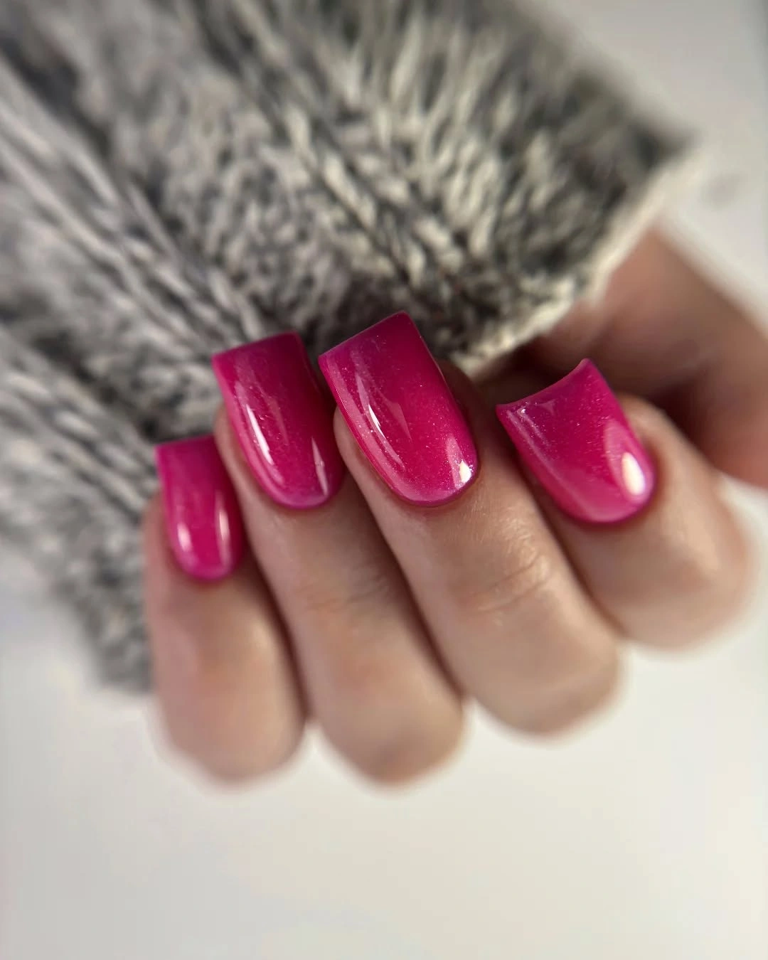 Medium square nails in saturated glossy fuchsia pink