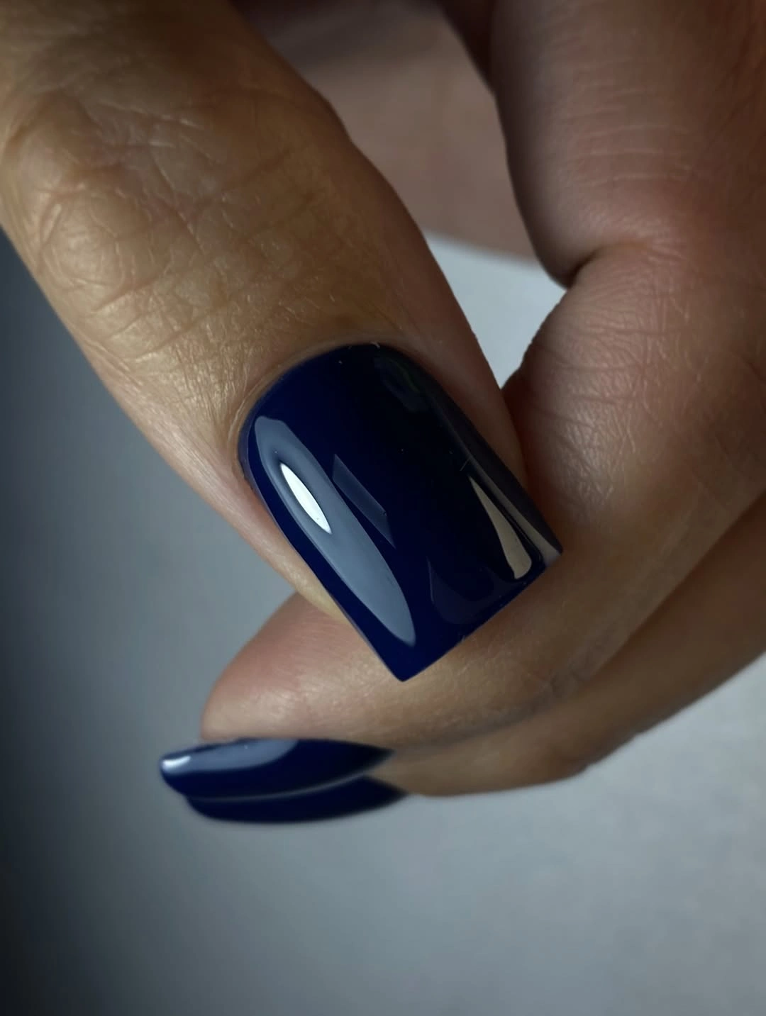 Long square nails in deep glossy navy blue