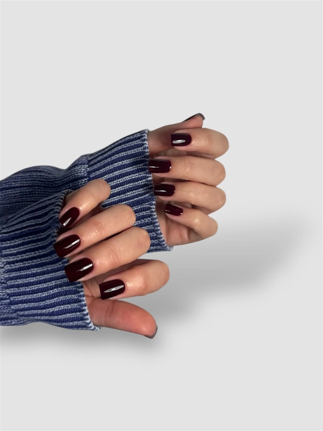 Medium square nails in glossy dark burgundy polish