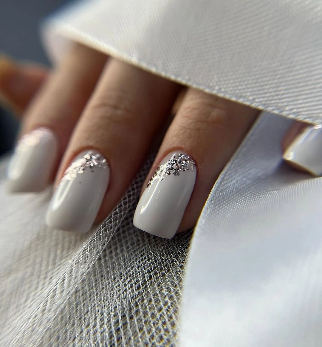 White square nails with silver cuticle clusters