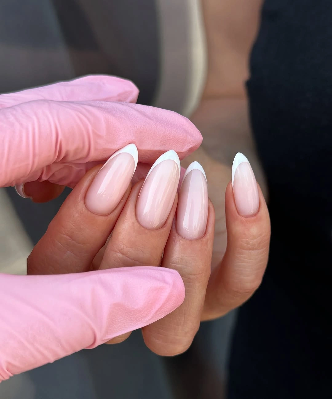Sheer pink almond nails with white French tips