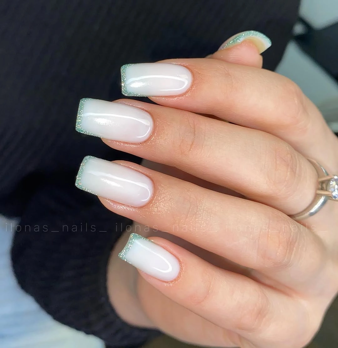 Milky square nails with pale mint glitter French tips