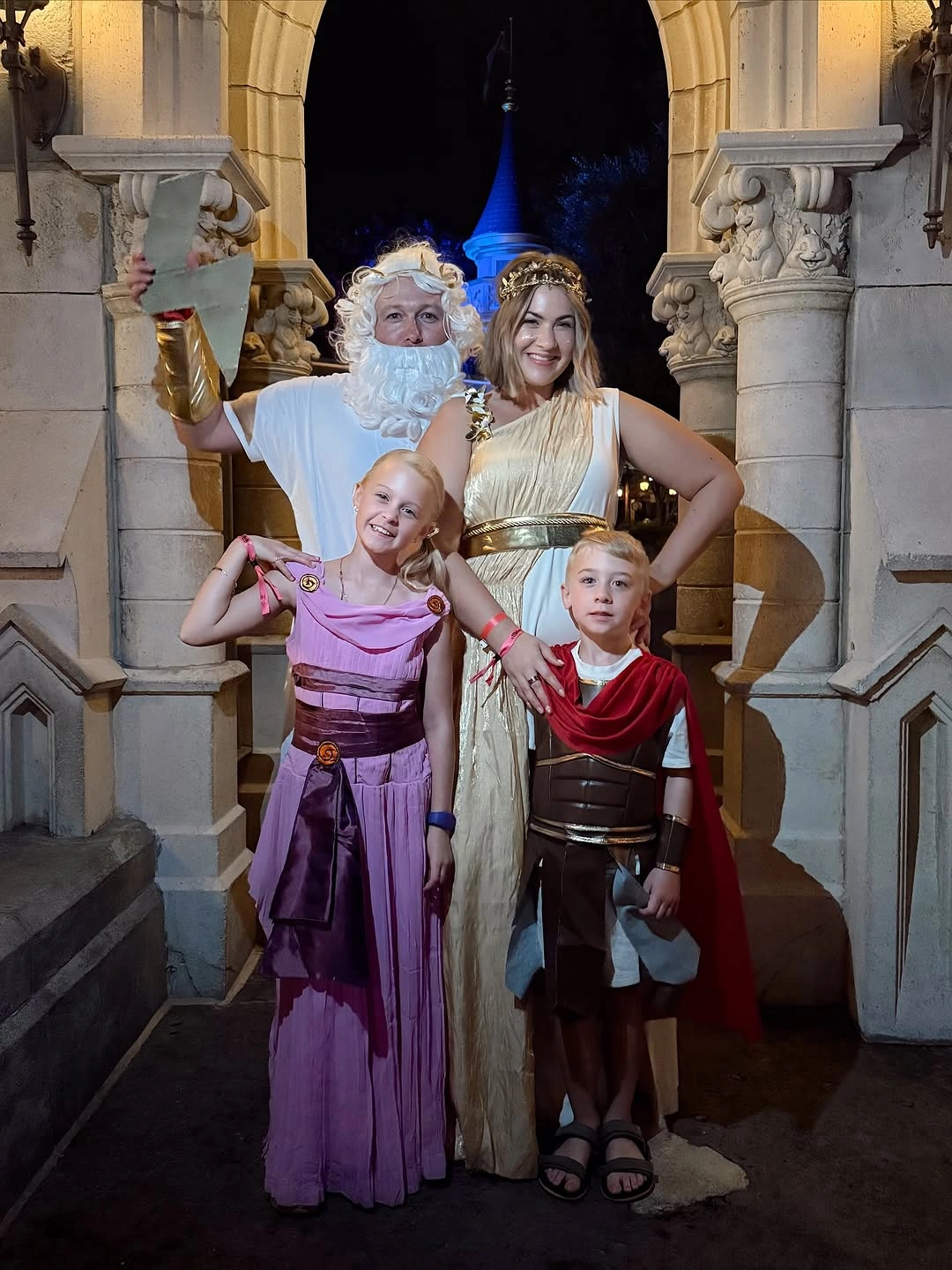 Fantasy family costumes in ivory gold lavender and dark layers