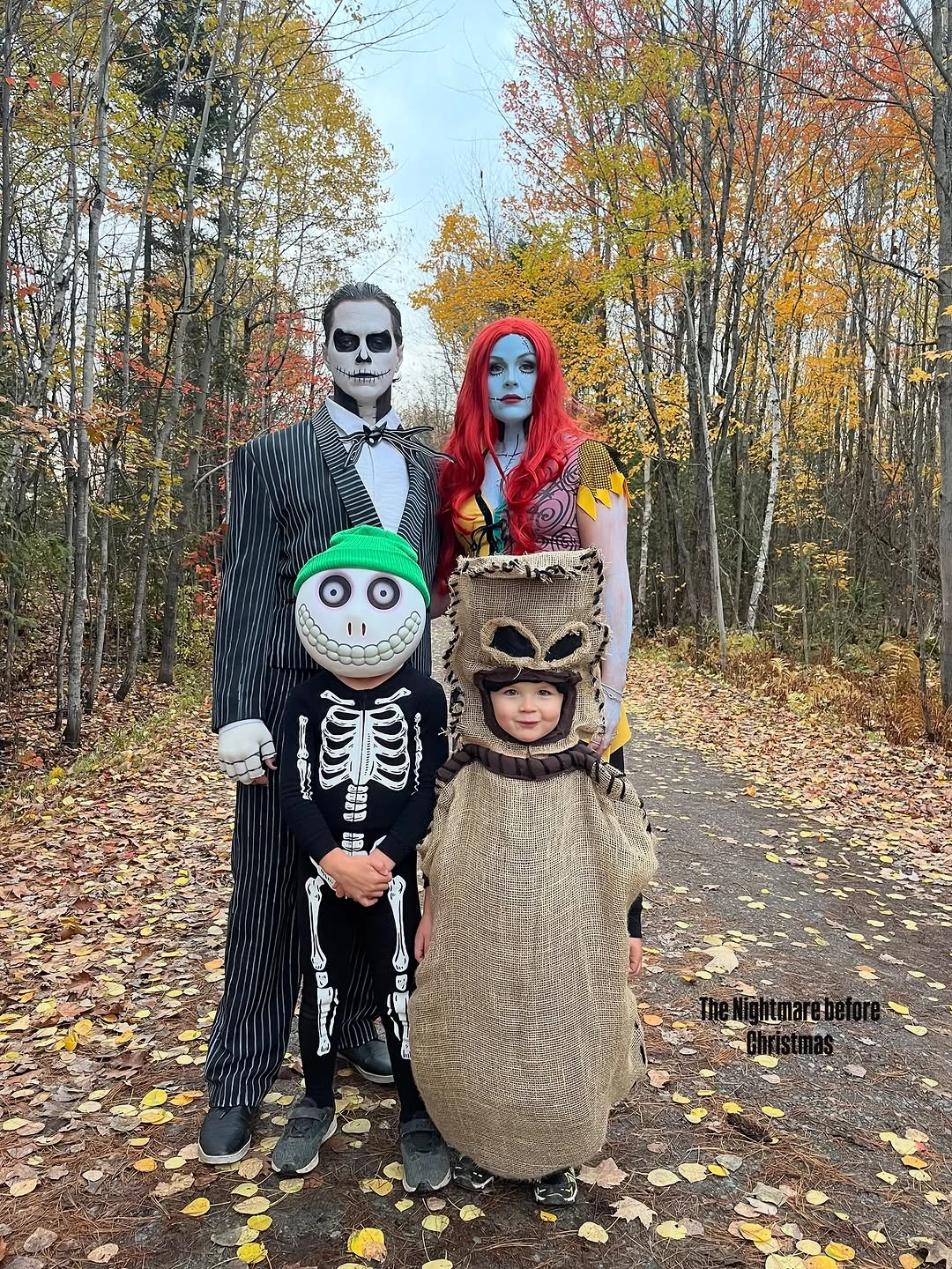 Family costumes with black white stripes red wig and skeleton print