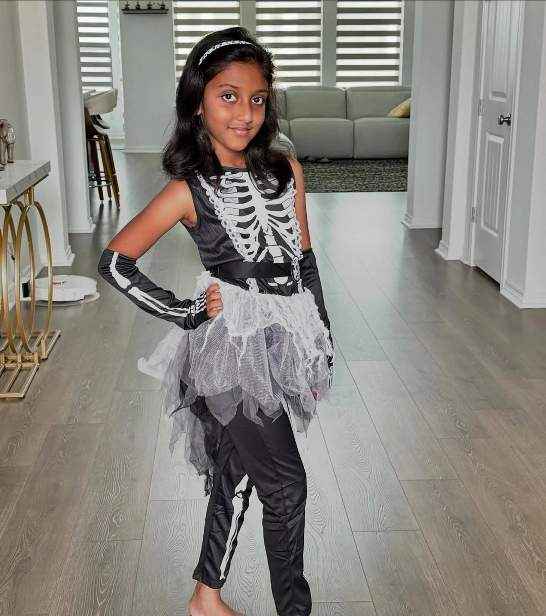 Skeleton bodysuit with white tulle skirt black leggings gloves and hair accessory