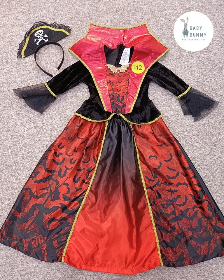 Red and black pirate dress with gold trim hat eye patch and layered skirt
