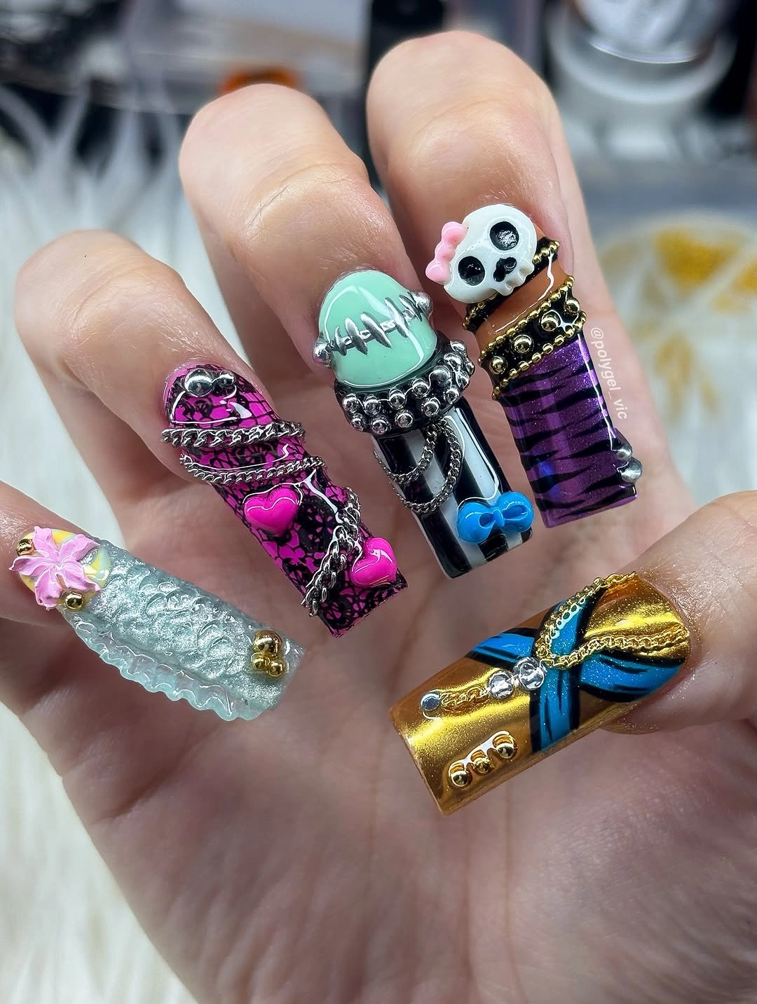 Very long coffin nails with colorful raised Halloween charms and bows