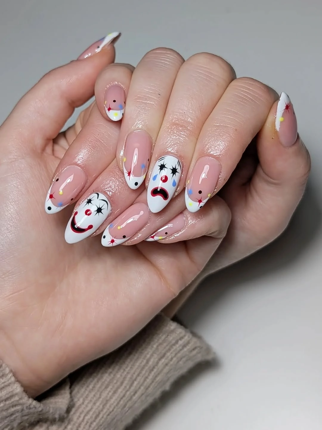 Medium almond pink white nails with cartoon ghost faces