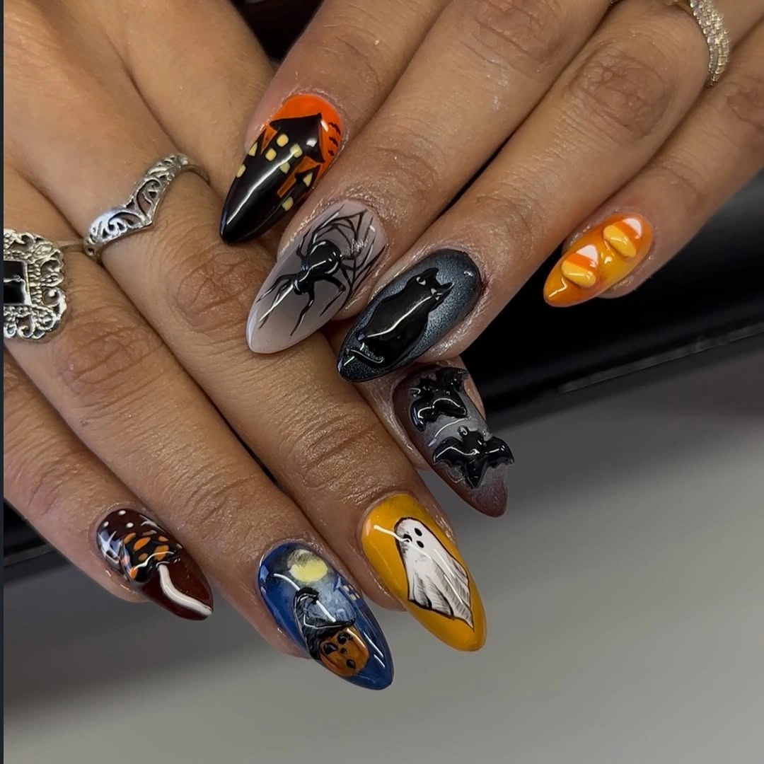 Long almond black orange yellow nails with Halloween icons