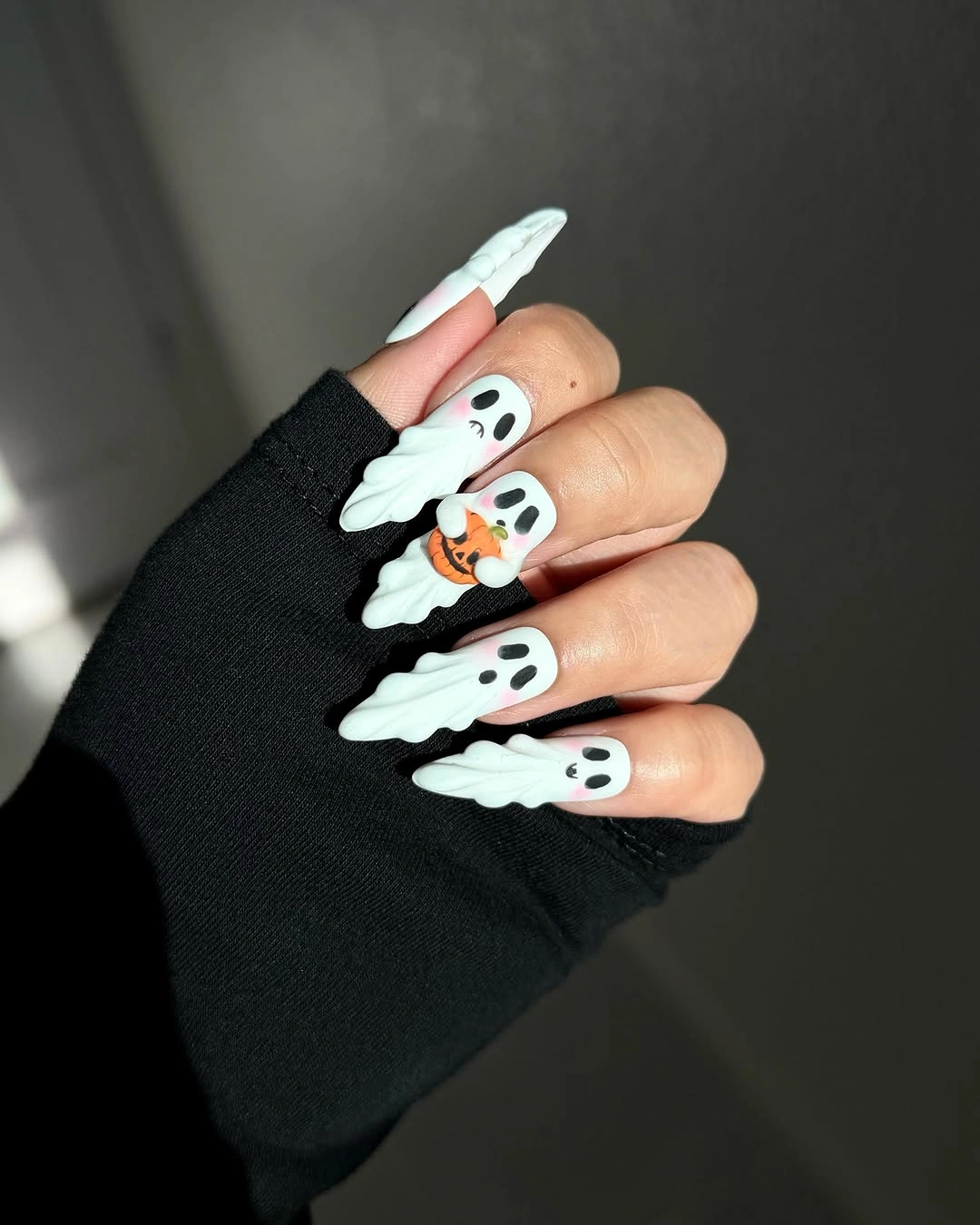 Very long coffin nails with raised white ghost shapes