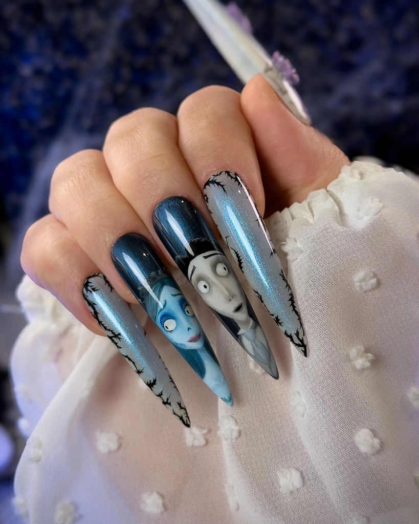 Very long blue black nails with cool eye and web details