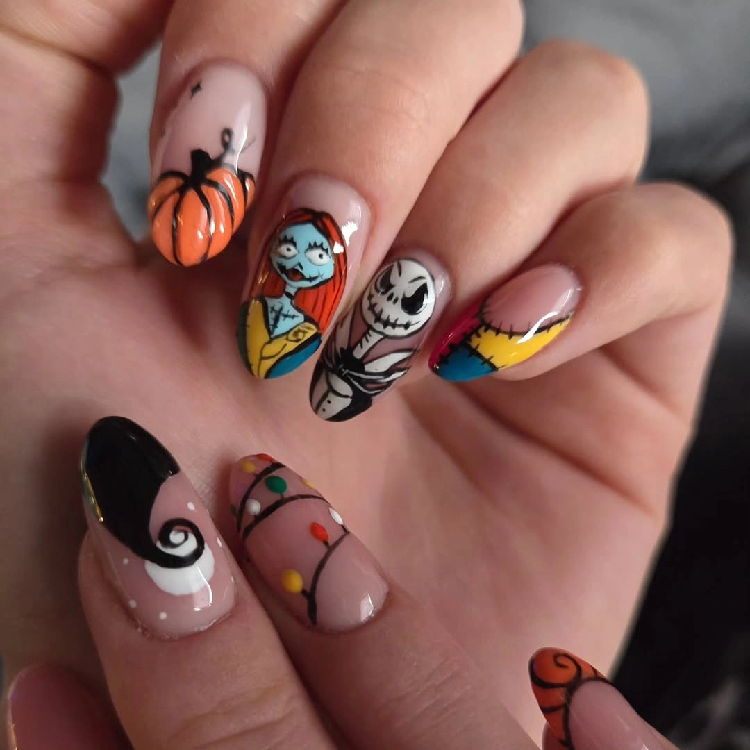 Short nude nails with pumpkin spiral skeleton and colorful Halloween symbols