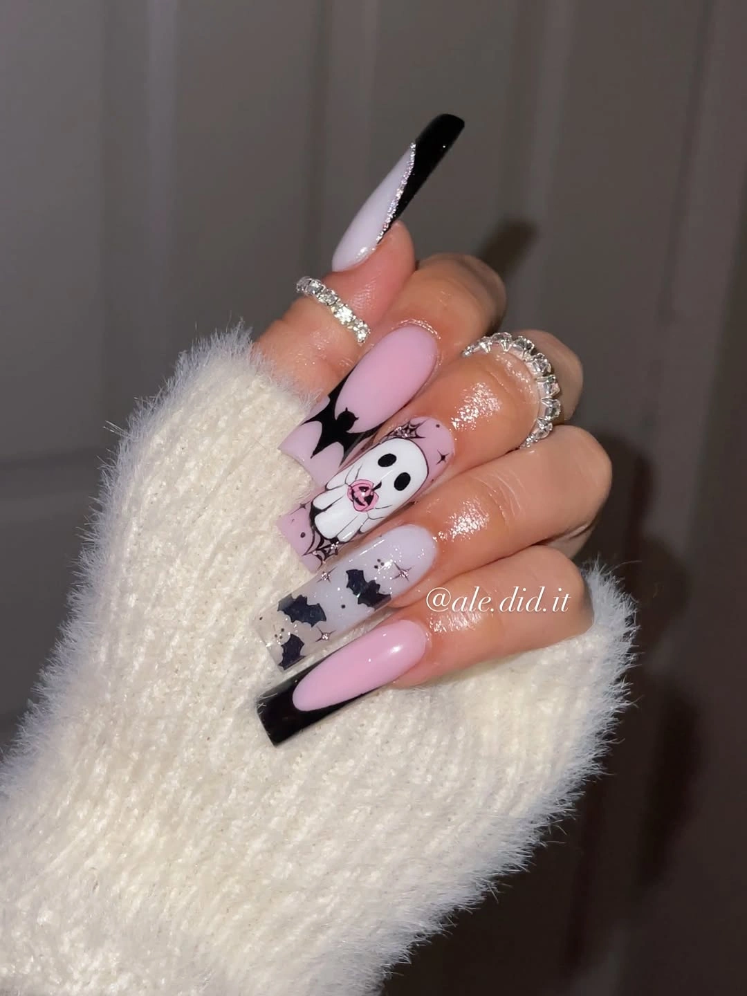 Long stiletto burgundy black nails with spiral and web accents