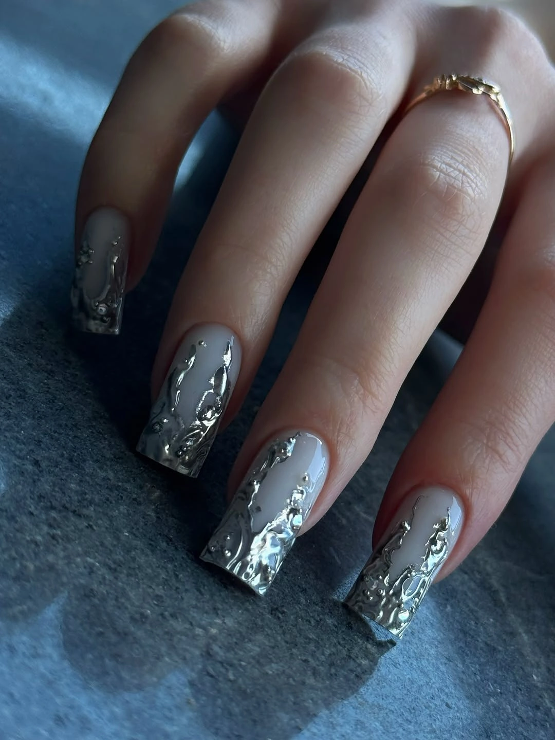 Medium almond smoky gray nails with silver foil and dark accents