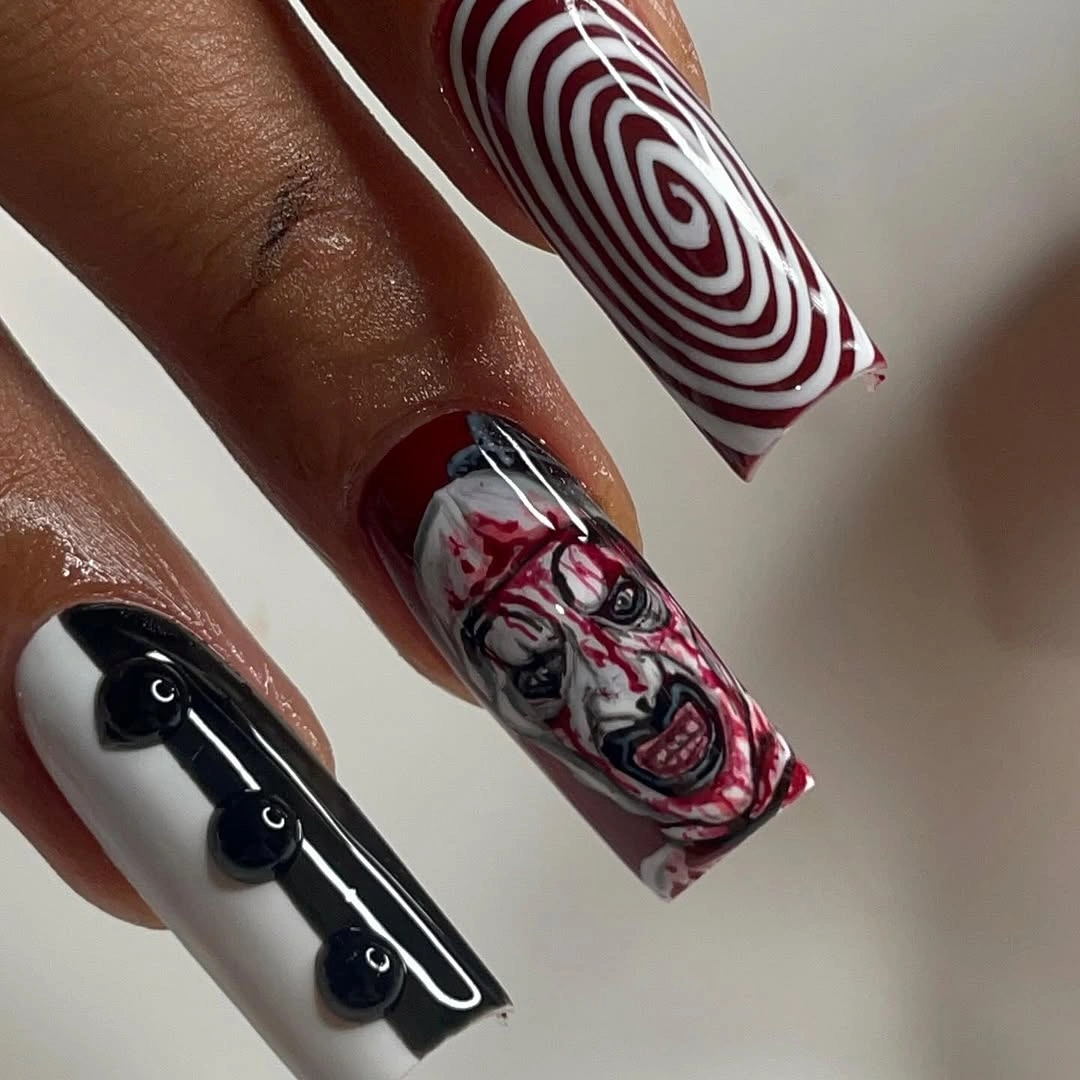 Medium almond lavender nails with orange purple Halloween icons