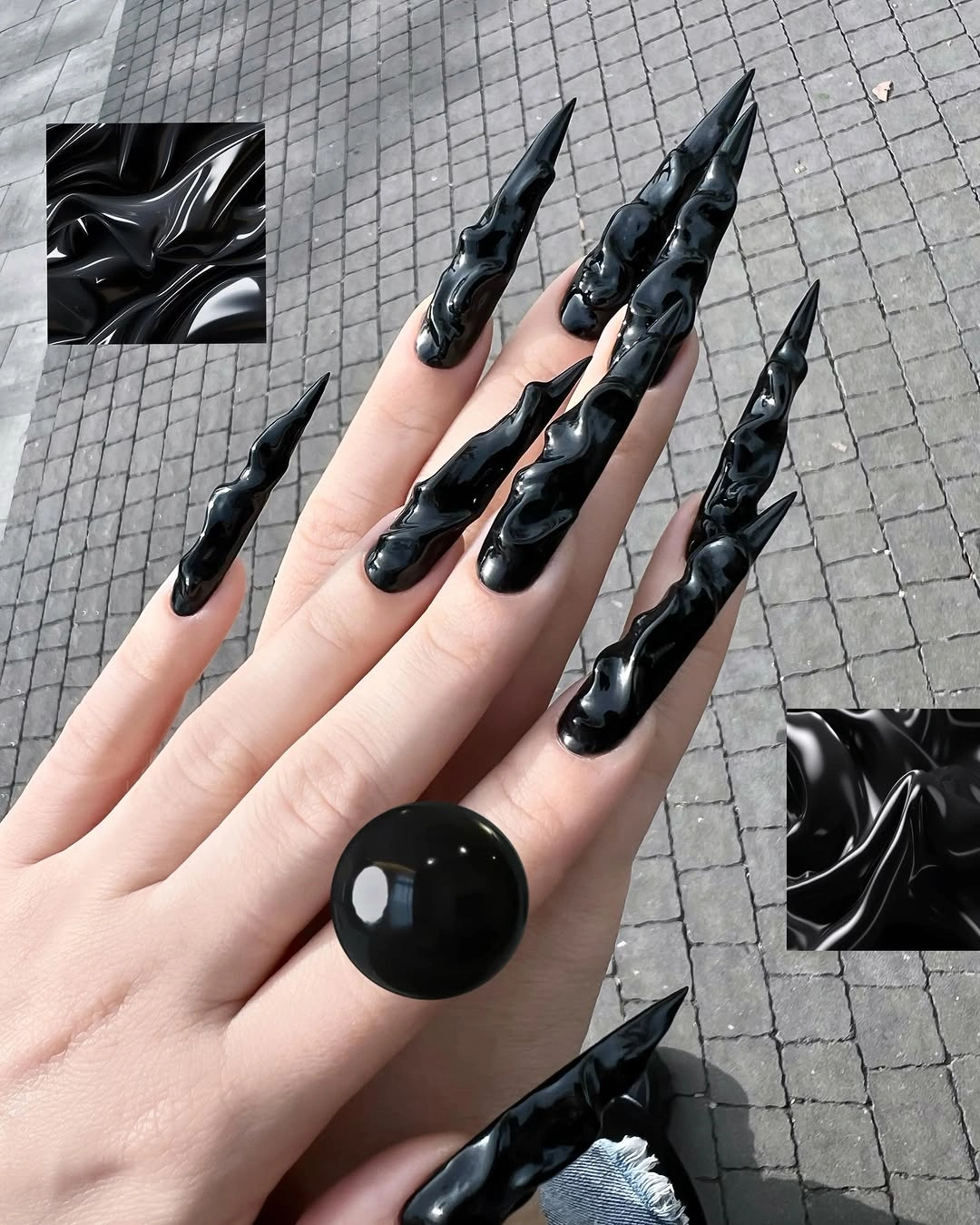 Extreme stiletto black nails with gray marbled veins and texture
