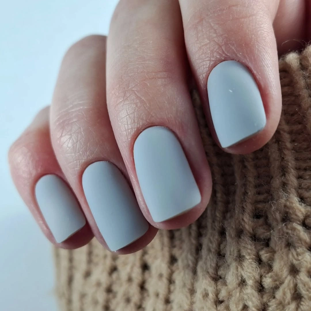 Short soft square nails in a cool gray-blue matte finish