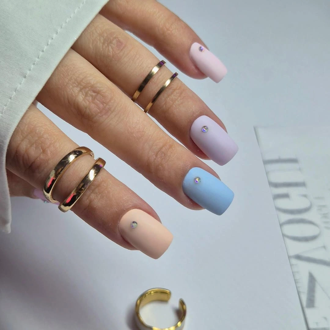 Matte lilac blue blush and nude square nails with tiny studs