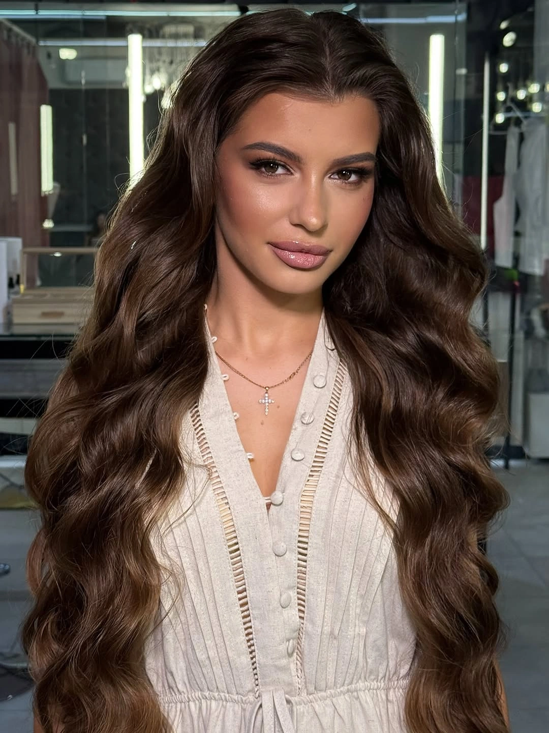 Very long dark brunette center-parted hair with relaxed open waves