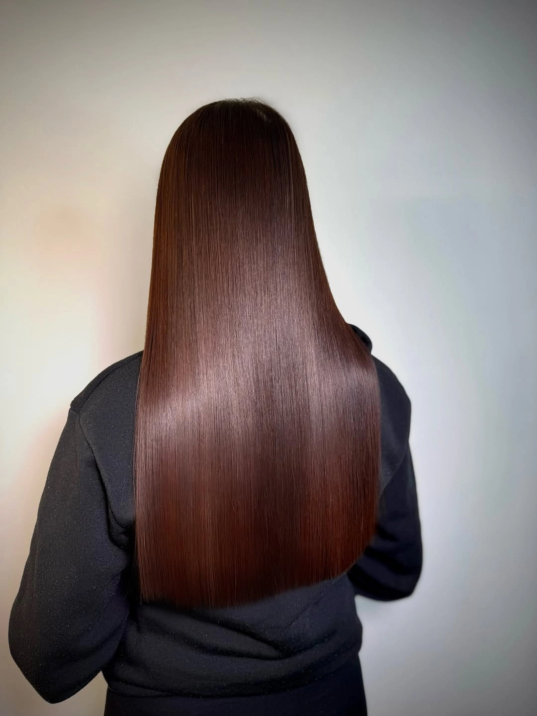 Very long straight brown hair with a smooth rounded back finish
