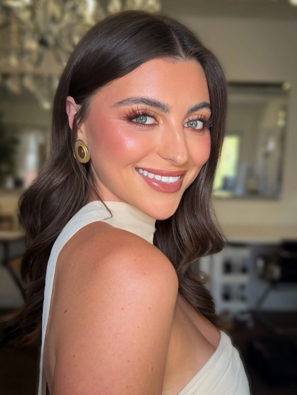 Shoulder-length brunette hair with a center part and soft bent ends