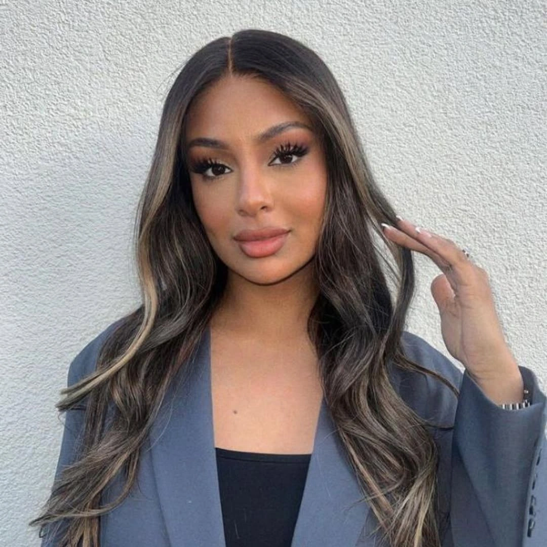Long brunette center-parted waves with lighter face-framing pieces