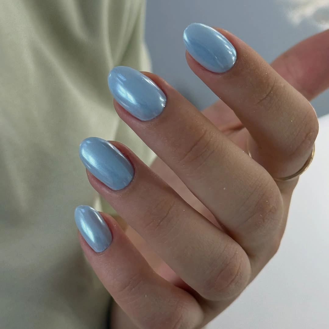 Short oval nails in glossy powder blue polish