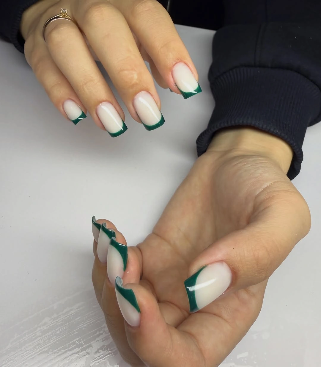 Medium milky square nails with deep green French tips