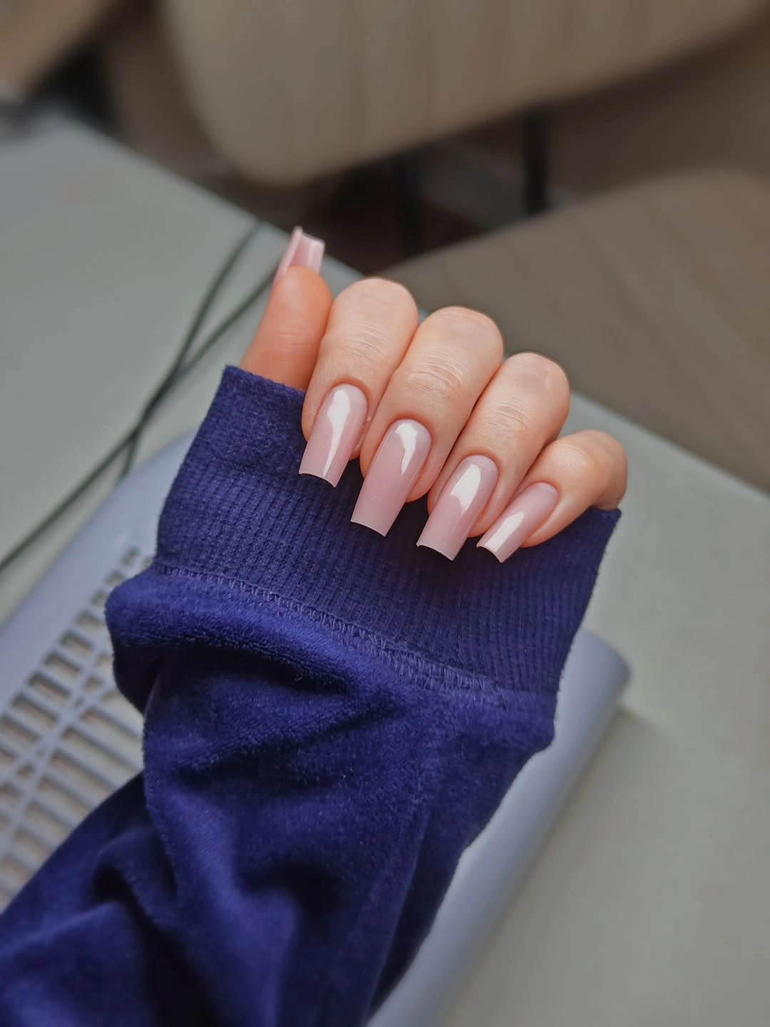 Long blush square nails with curved white panels