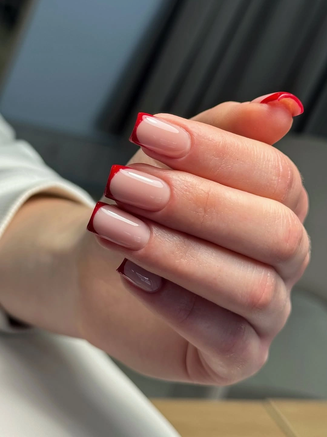 Medium milky pink square nails with vivid red edging