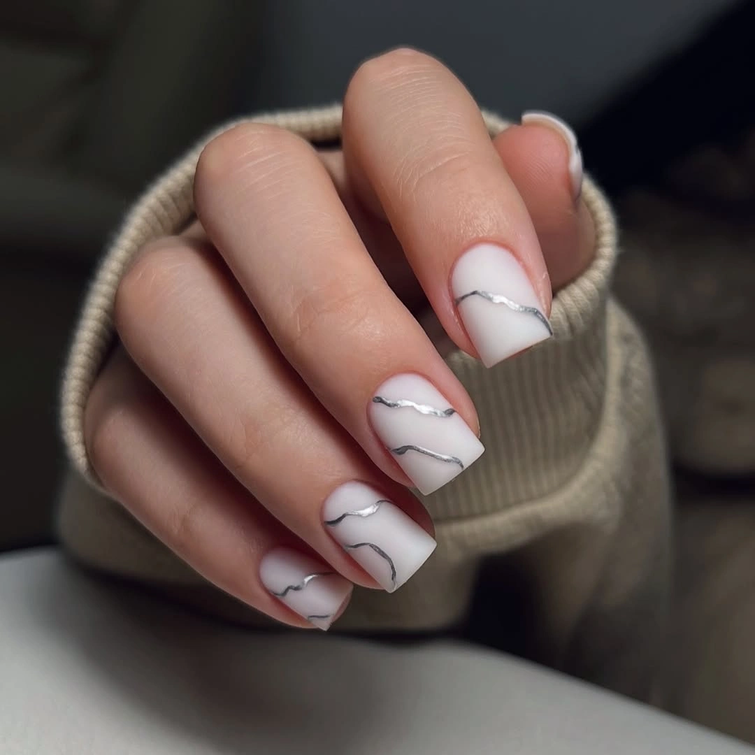 Medium milky square nails with delicate charcoal wave lines