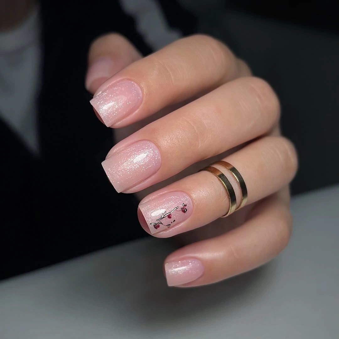 Medium pink square nails with pearl shimmer and tiny accent