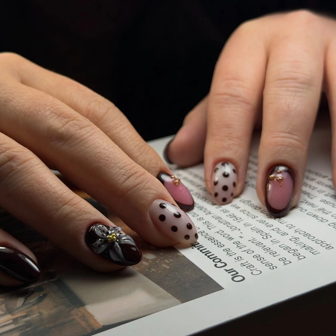 Cream and cocoa almond nails with brown dots and small metallic accents
