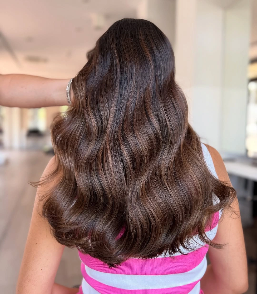 Long dark brunette waves with subtle warm brown dimension