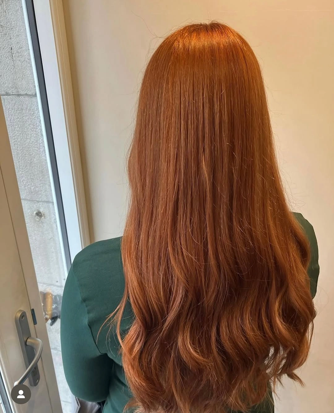Long saturated copper auburn hair with soft waves