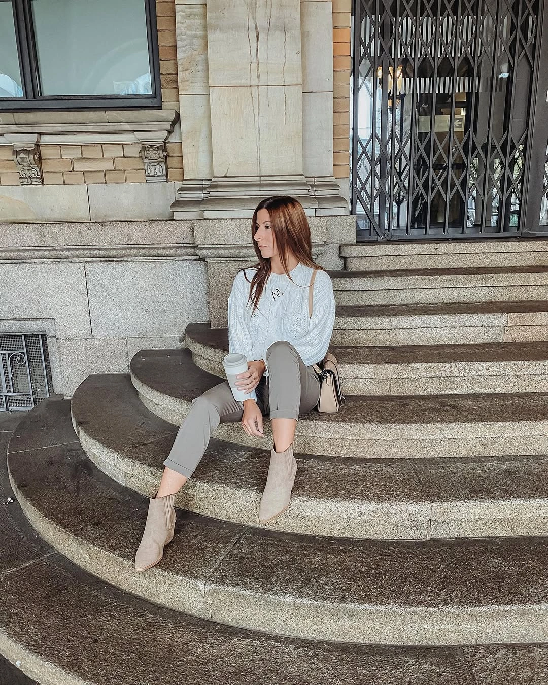 Pale gray sweater with taupe trousers and beige ankle boots